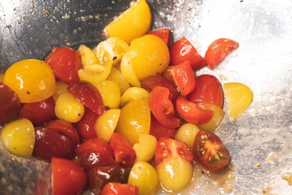 halved tomatoes in olive oil