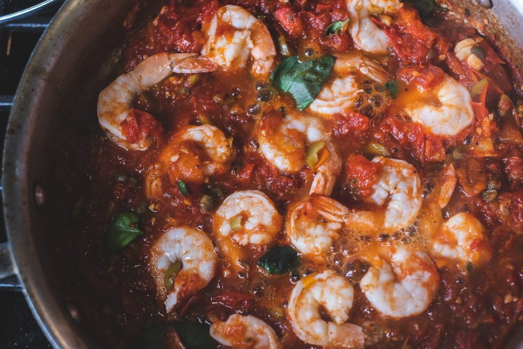 view of shrimp poached in red sauce
