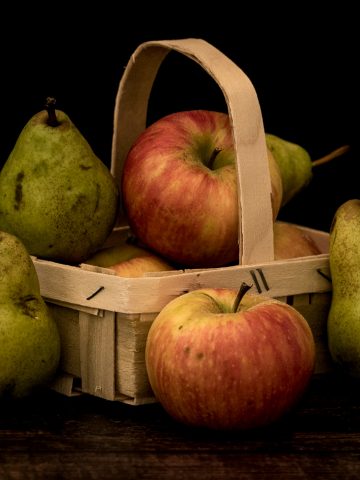 Apples and pears in small basket