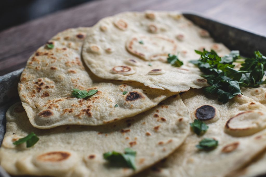 flour tortillas in a pan with parsley