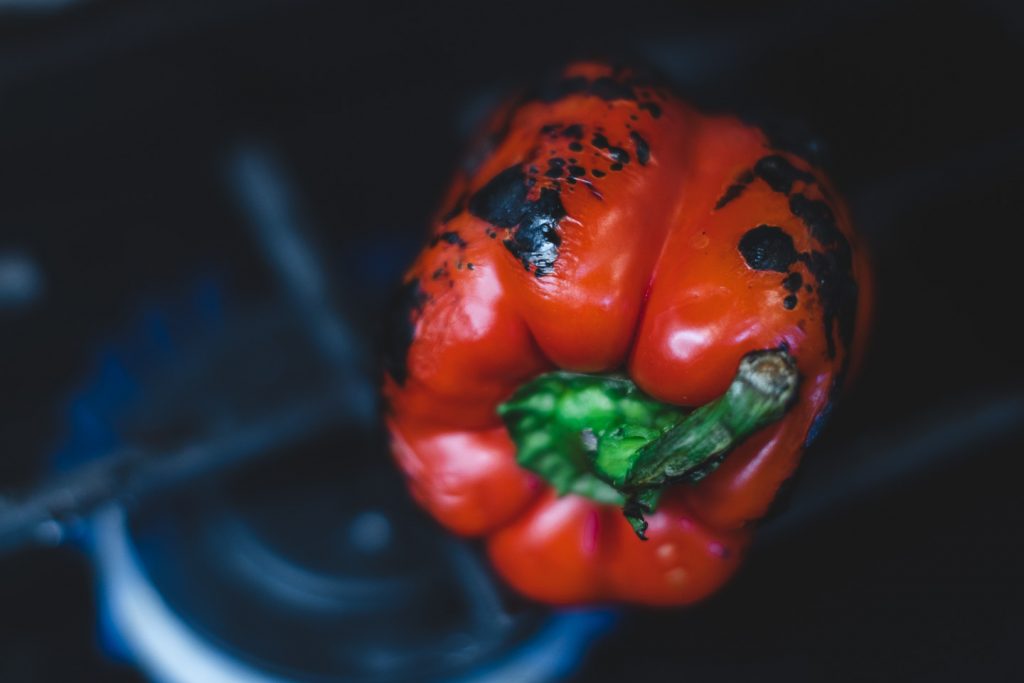 red bell pepper charring on stove top