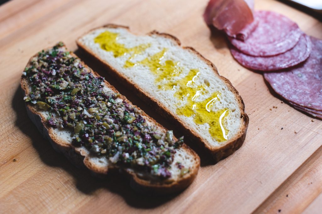sandwich bread with tapenade and extra virgin olive oil