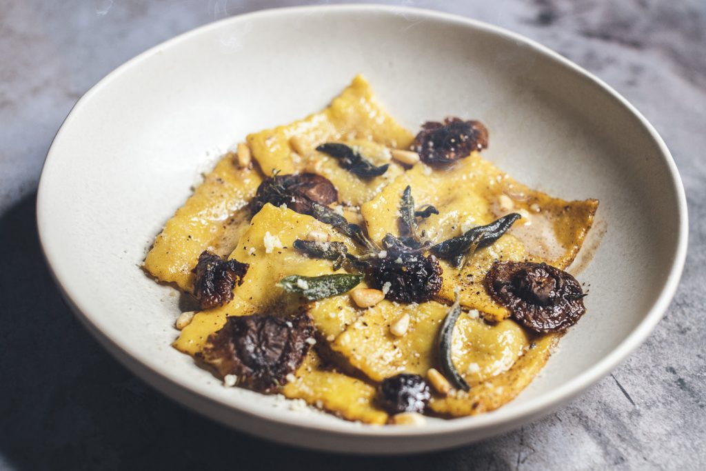 butternut squash ravioli with sage shiitake mushoroom and browned butter side view