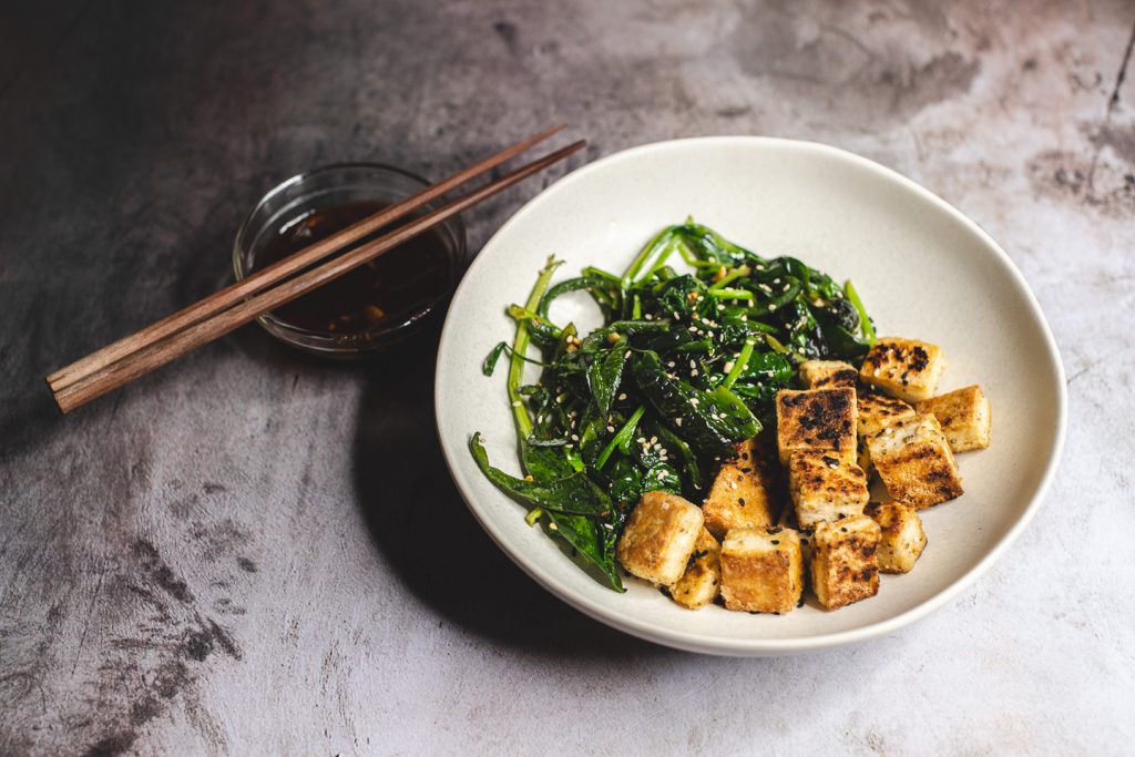 Tofu Squares With Sauteed Spinach And Sauce