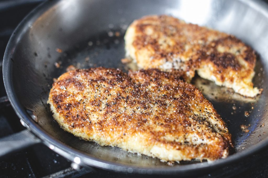 panko breaded chicken frying in grapeseed oil all clad 10 inch pan [copyright david lewetag ii]