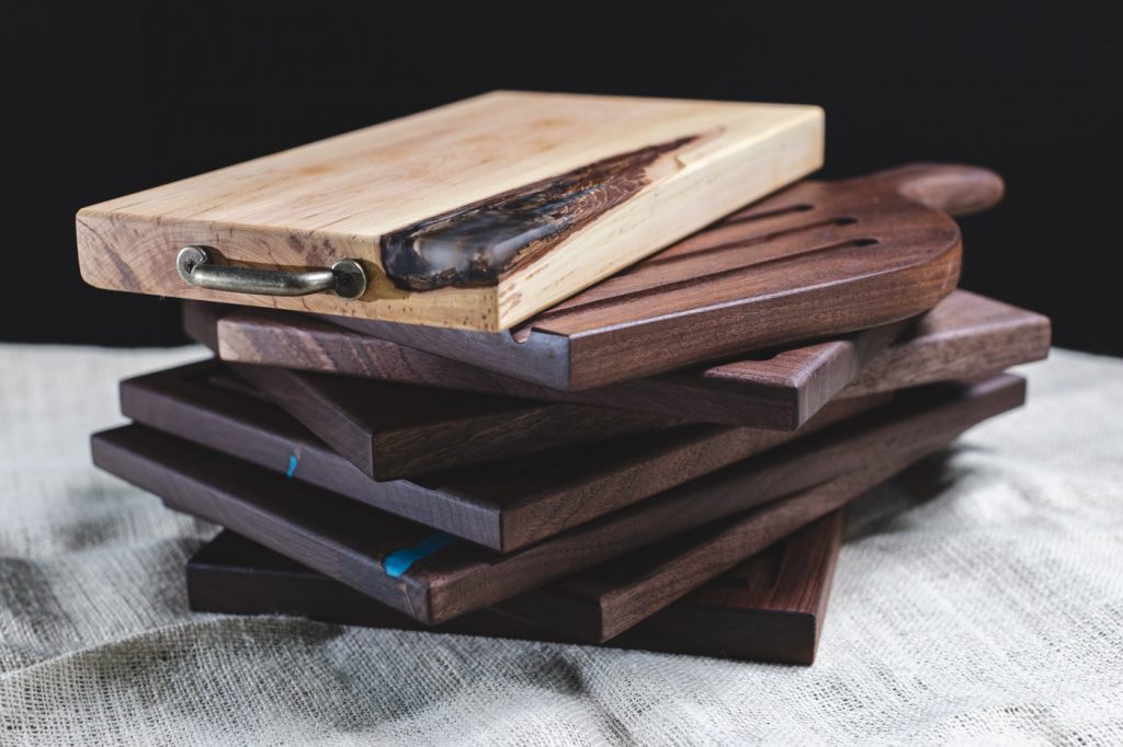 stack of custom made cutting and charcuterie boards